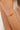Bracelet with colorful beads on a wrist against a neutral background