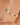 Bracelet with green and white gemstones on a wrist against a blurred background
