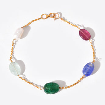 Bracelet with multicolored gemstones on a white background