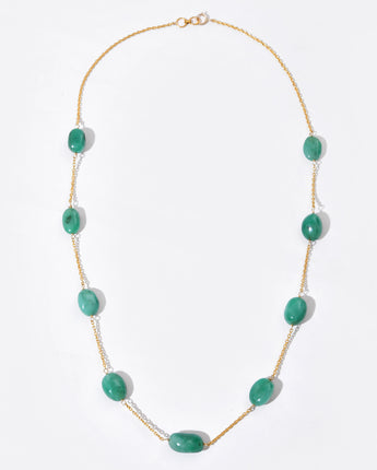 Necklace with green beads on a white background