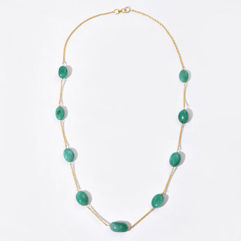 Necklace with green beads on a white background