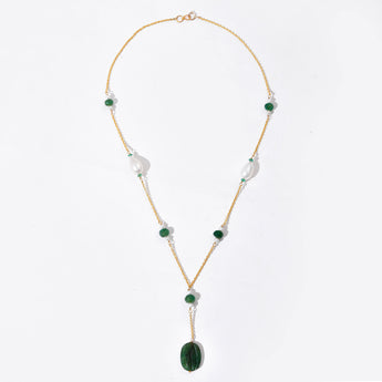 Necklace with green and white beads on a white background