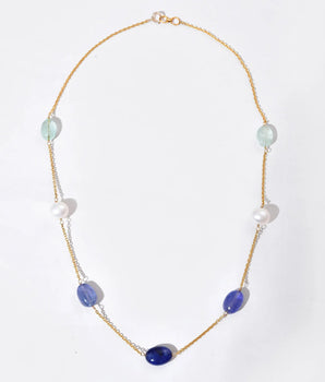 Necklace with purple and white beads on a white background