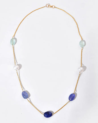 Necklace with purple and white beads on a white background