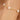 Gold bracelet with pearls on a wrist against a blurred background