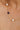 Necklace with pearls and a blue gemstone on a woman's neck