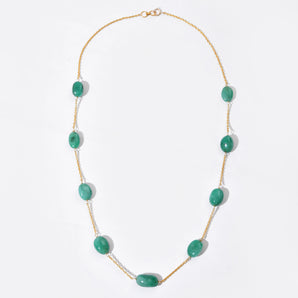 Necklace with green beads on a white background